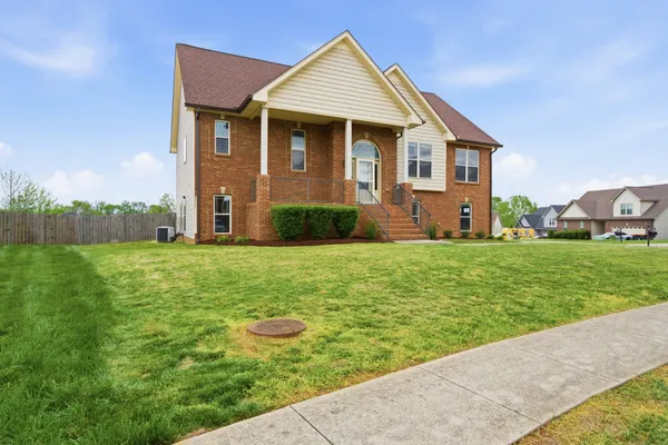 a front view of a house with garden