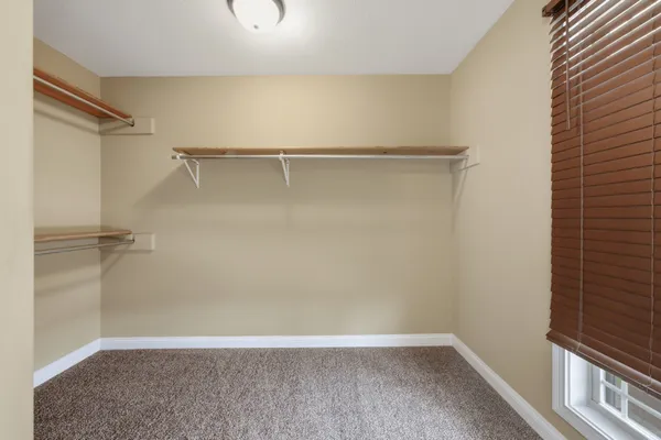 a view of an empty walk in closet