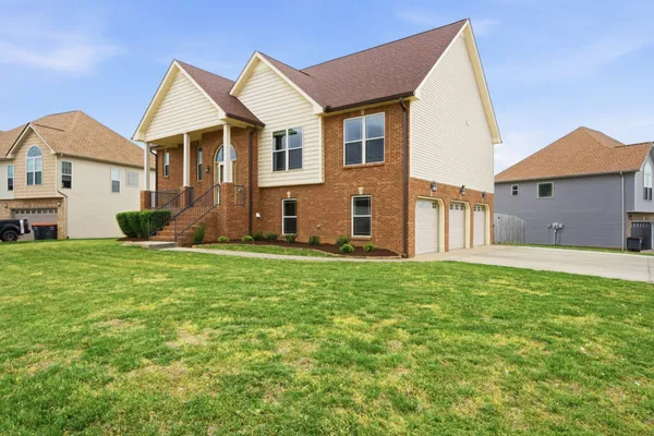a view of a house with a back yard