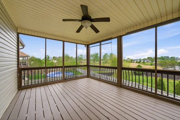 a view of a balcony with furniture