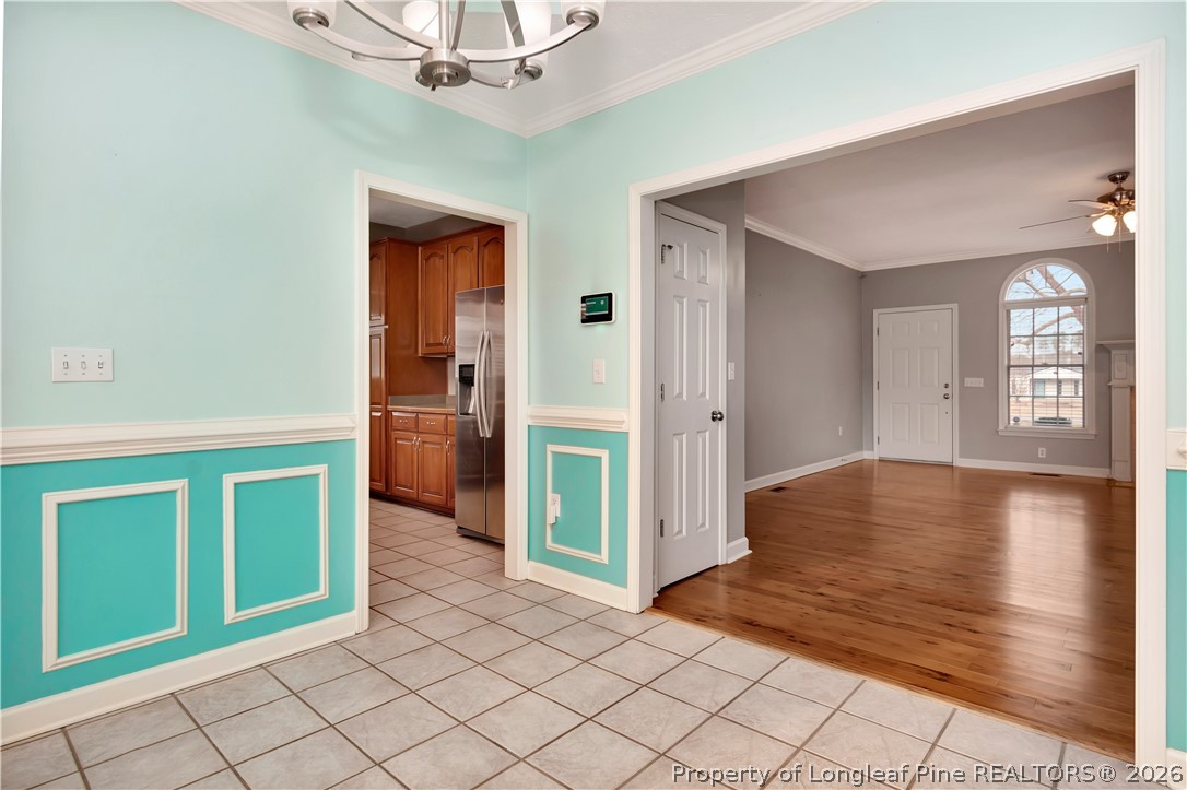 143 Pridgen Road Lumberton, NC 28358 - Photo 12 of 37 a view of a hallway with wooden cabinet and a livingroom