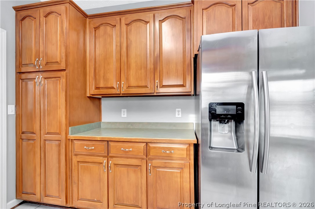 143 Pridgen Road Lumberton, NC 28358 - Photo 15 of 37 a kitchen with a refrigerator and cabinets