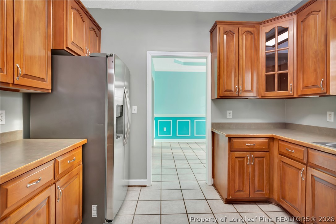143 Pridgen Road Lumberton, NC 28358 - Photo 17 of 37 a kitchen with stainless steel appliances granite countertop a refrigerator and a sink