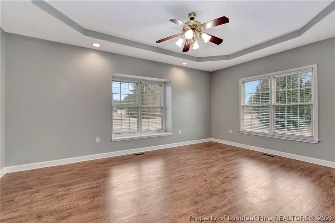 143 Pridgen Road Lumberton, NC 28358 - Photo 20 of 37 a view of an empty room with a window and wooden floor