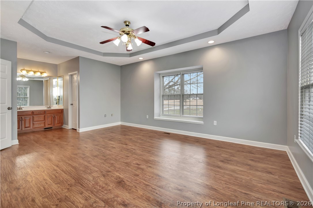143 Pridgen Road Lumberton, NC 28358 - Photo 22 of 37 wooden floor in an empty room with a window
