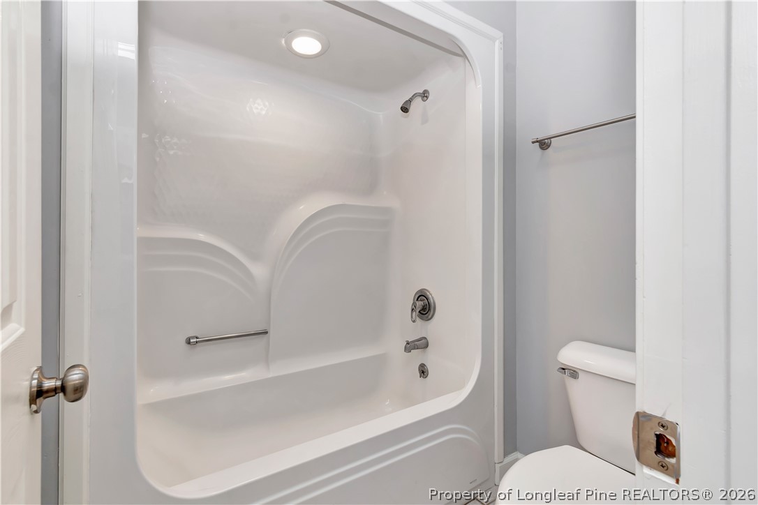 143 Pridgen Road Lumberton, NC 28358 - Photo 24 of 37 a bathroom with a toilet and a shower