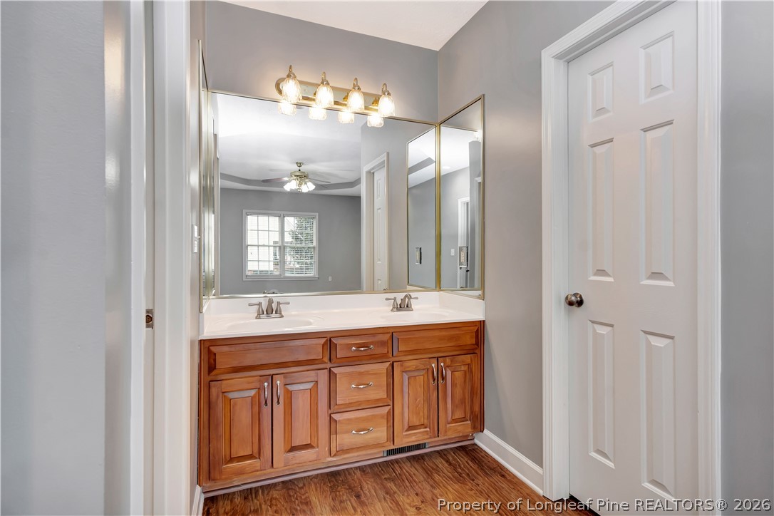 143 Pridgen Road Lumberton, NC 28358 - Photo 25 of 37 a bathroom with a double vanity sink and a mirror