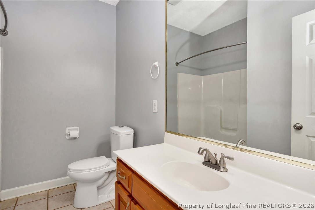 143 Pridgen Road Lumberton, NC 28358 - Photo 29 of 37 a bathroom with a sink toilet and vanity