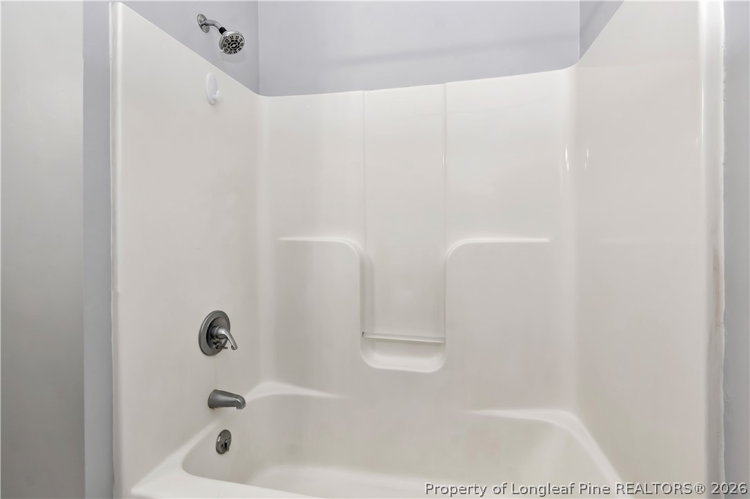 143 Pridgen Road Lumberton, NC 28358 - Photo 30 of 37 a bathroom with a bathtub