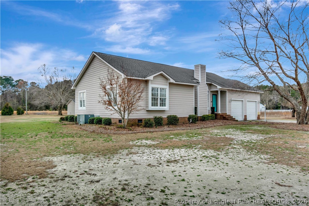 143 Pridgen Road Lumberton, NC 28358 - Photo 3 of 37 a view of a house with a yard