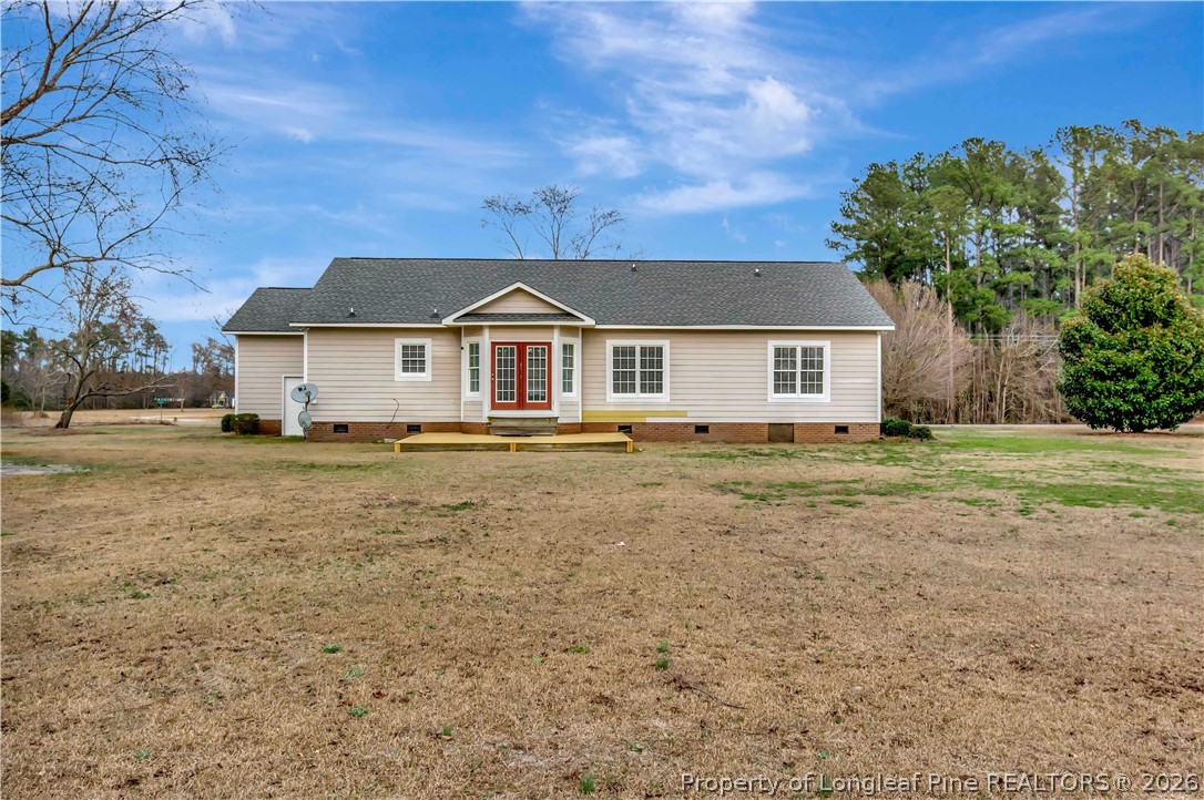 143 Pridgen Road Lumberton, NC 28358 - Photo 33 of 37 a front view of a house with a garden