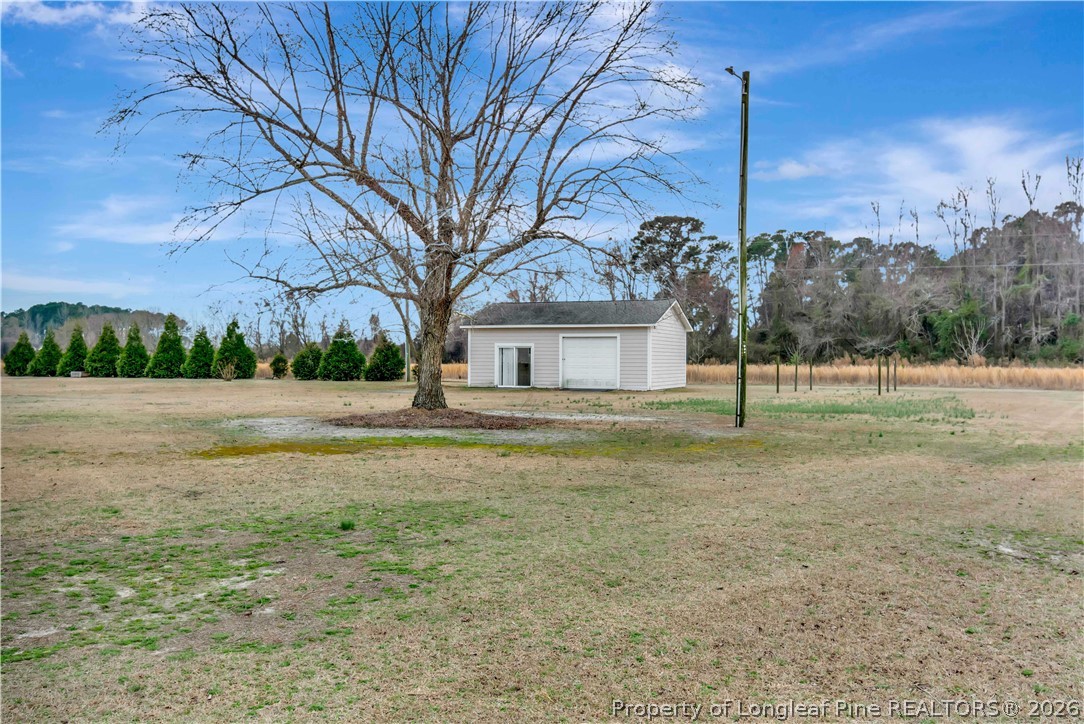 143 Pridgen Road Lumberton, NC 28358 - Photo 36 of 37 a front view of a house with a yard