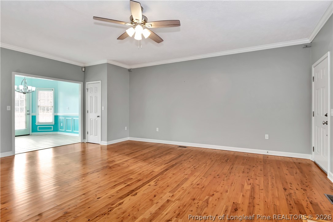 143 Pridgen Road Lumberton, NC 28358 - Photo 7 of 37 wooden floor in an empty room with a window