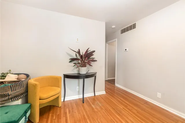a workspace with furniture and wooden floor