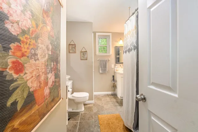 a bathroom with a shower and a toilet