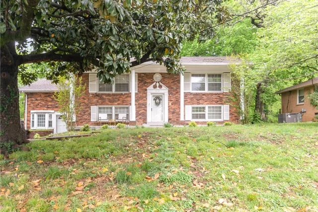 front view of a house with a big yard