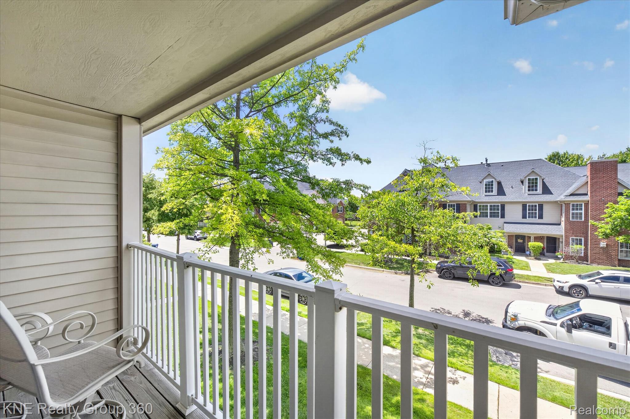 4077 Berkeley Avenue Canton, MI 48188 - Photo 26 of 32 Balcony featuring horizontal siding, white railing, and wood-finish flooring