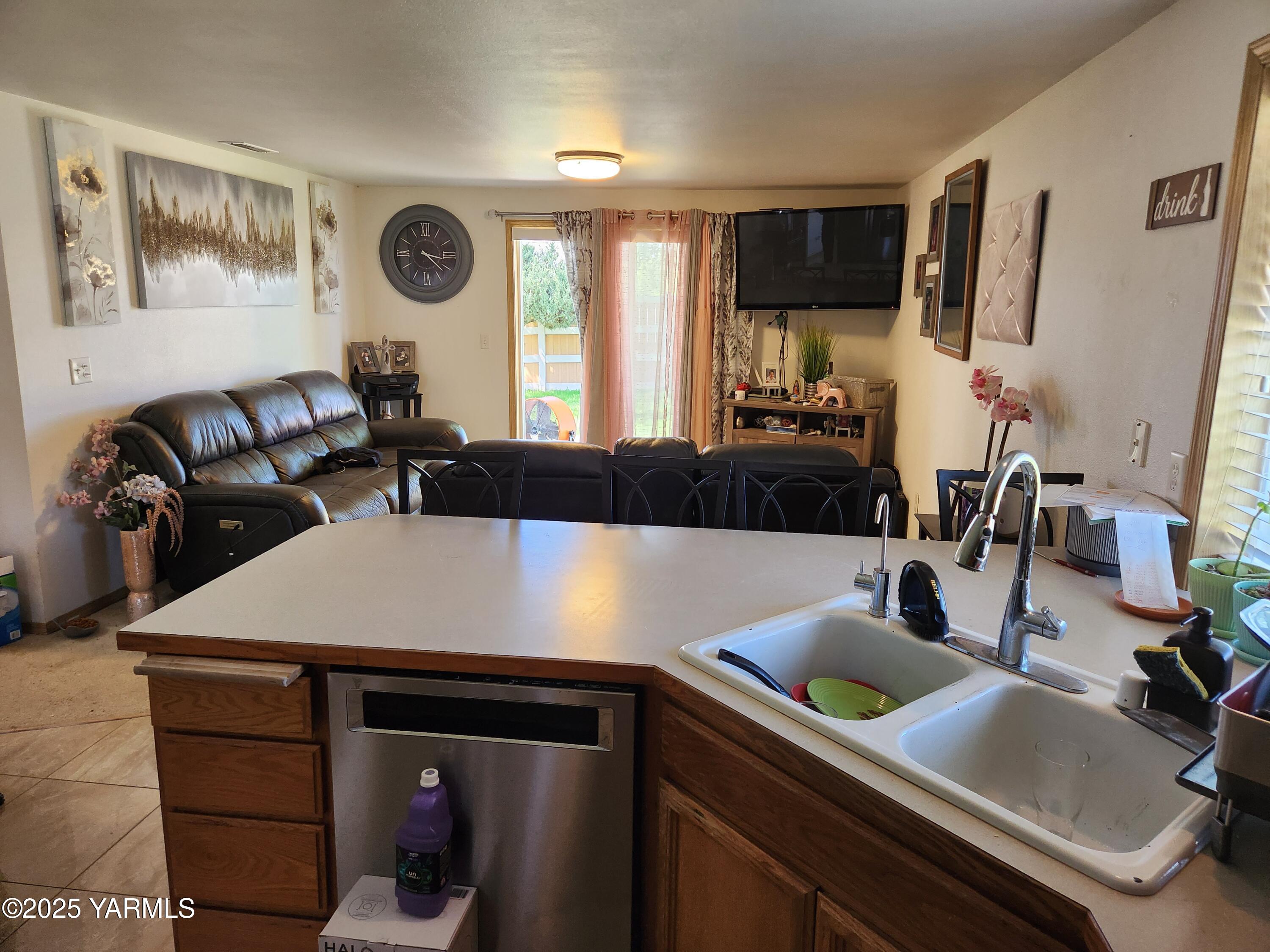 a kitchen with a sink cabinets and window