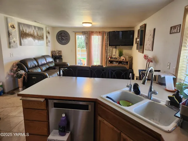 a kitchen with a sink cabinets and window