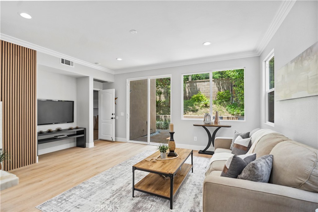 2129 Studio Drive Brea, CA 92821 - Photo 22 of 43 a living room with furniture and a flat screen tv