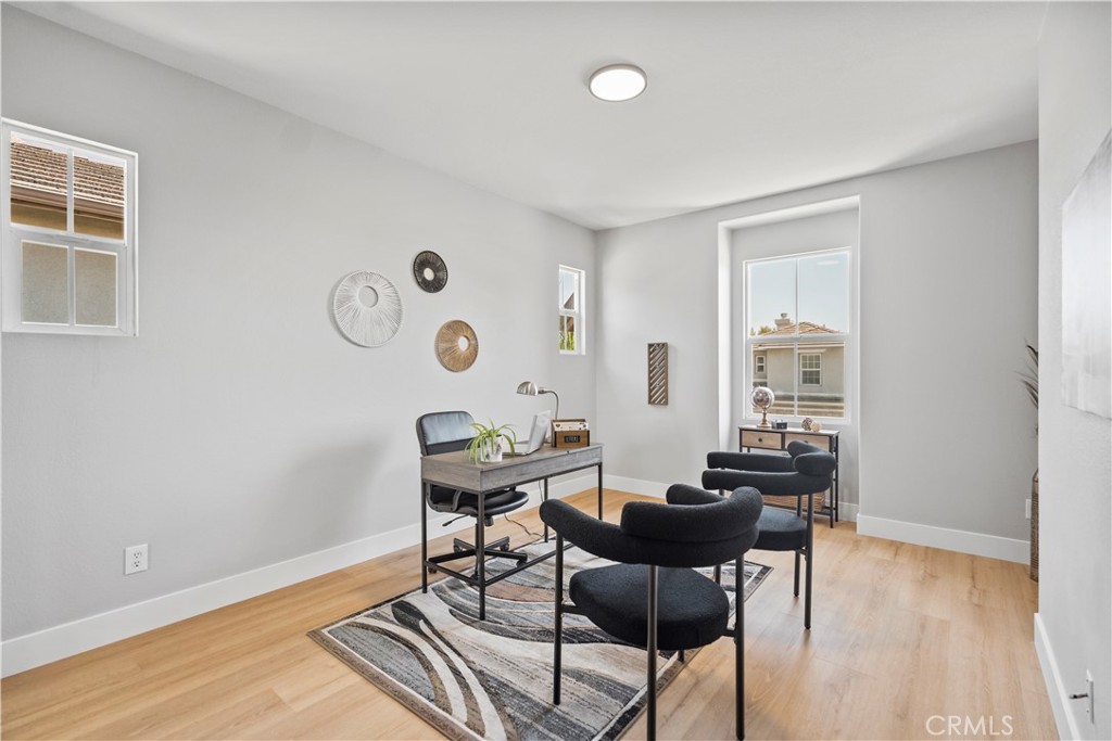 2129 Studio Drive Brea, CA 92821 - Photo 37 of 43 a view of a workspace with furniture and wooden floor