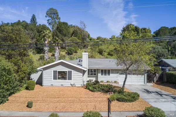 a house view with a garden space