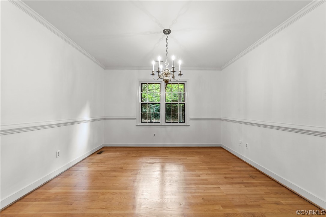 3917 Pebble Creek Road Midlothian, VA 23112 - Photo 26 of 50 Hardwood floored formal dining room with crown mol
