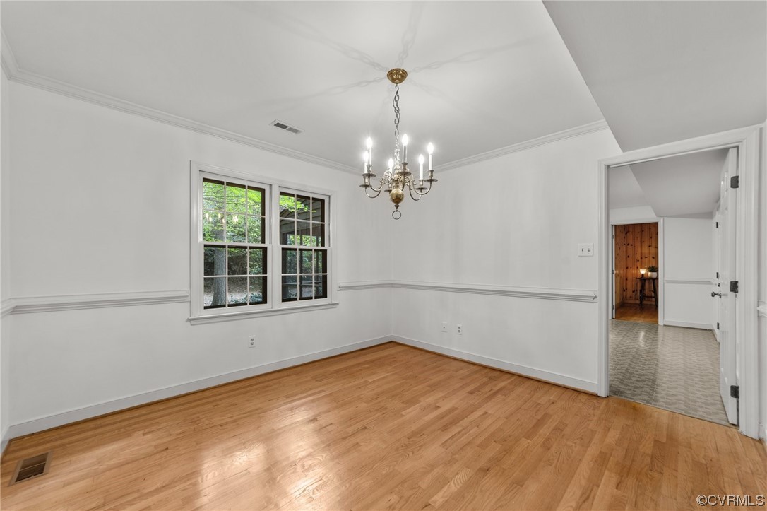 3917 Pebble Creek Road Midlothian, VA 23112 - Photo 27 of 50 Hardwood floored formal dining room with crown mol