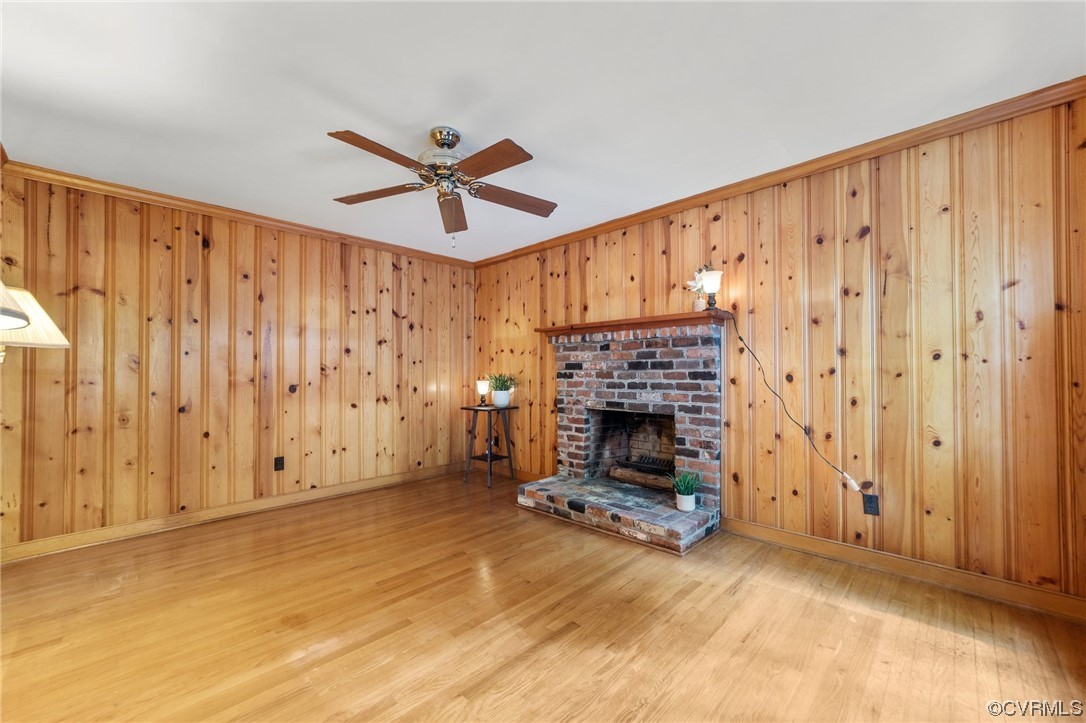 3917 Pebble Creek Road Midlothian, VA 23112 - Photo 37 of 50 Family room featuring crown molding, wood walls, l