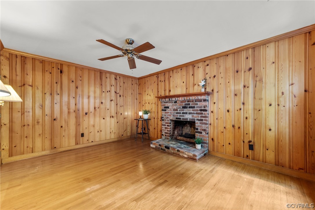 3917 Pebble Creek Road Midlothian, VA 23112 - Photo 38 of 50 Family room featuring crown molding, wood walls, l