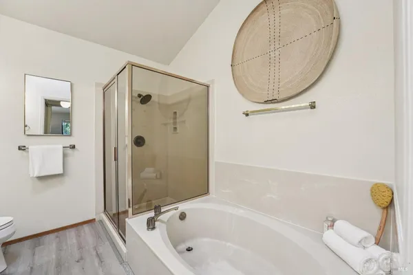 a bedroom with bed and a window