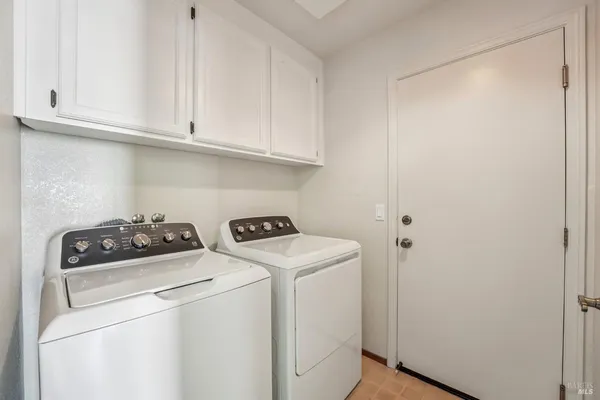 a view of a chairs and table in the balcony
