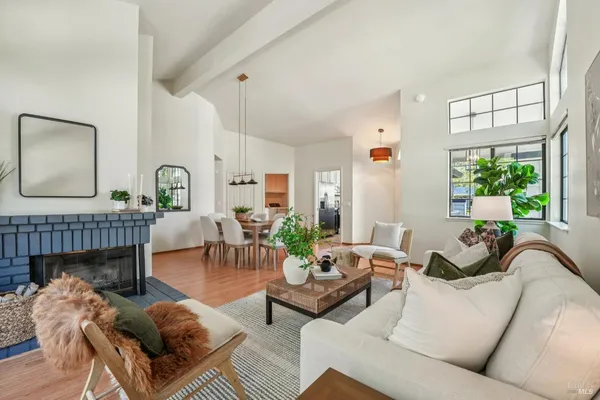 a view of a dining room with furniture window and wooden floor