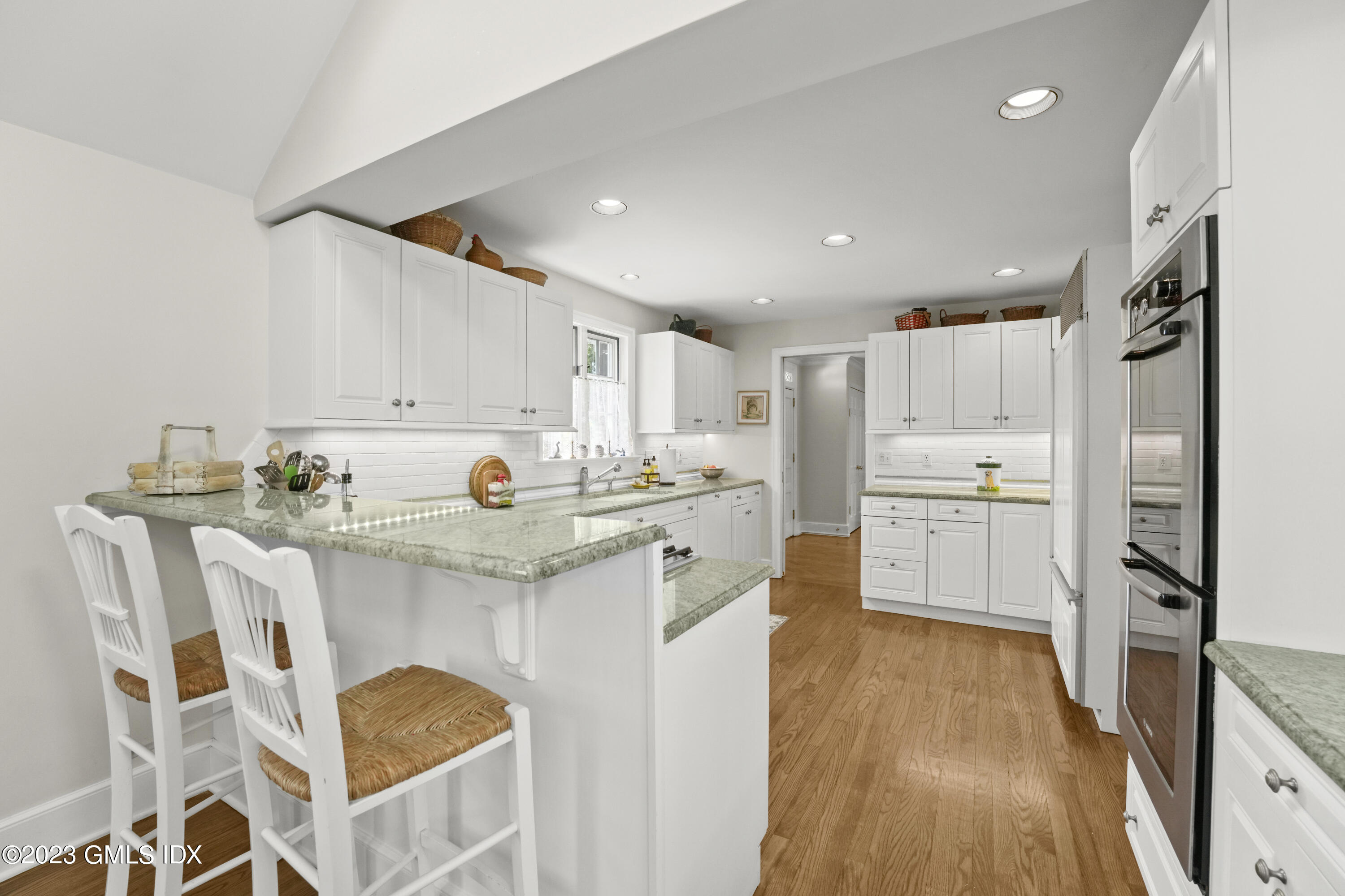 160 Stanwich Road Greenwich, CT 06830 - Photo 7 of 11 a kitchen with stainless steel appliances granite countertop a refrigerator and a stove top oven