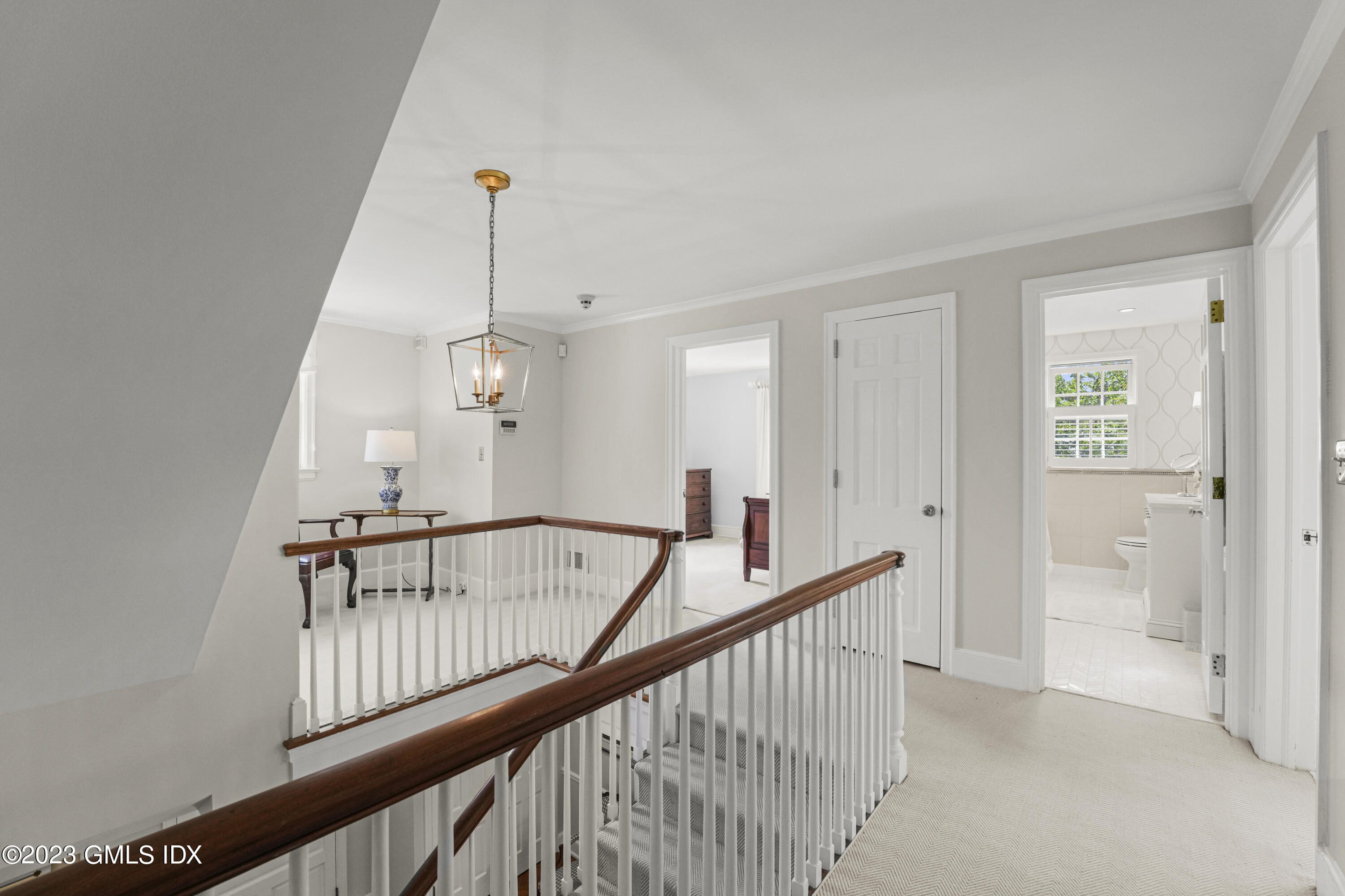 160 Stanwich Road Greenwich, CT 06830 - Photo 9 of 11 a view of a hallway with windows and stairs