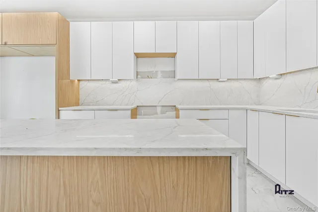 a bathroom with a bathtub and a sink