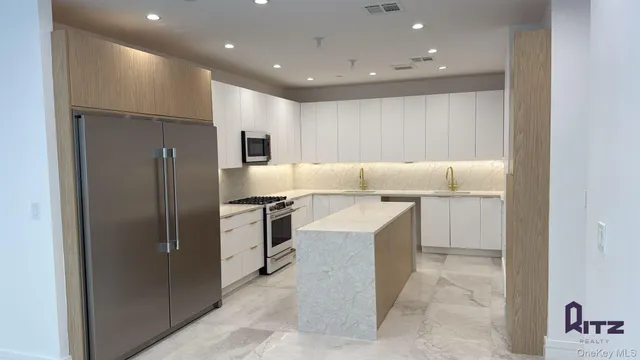 a stove top oven sitting inside of a kitchen