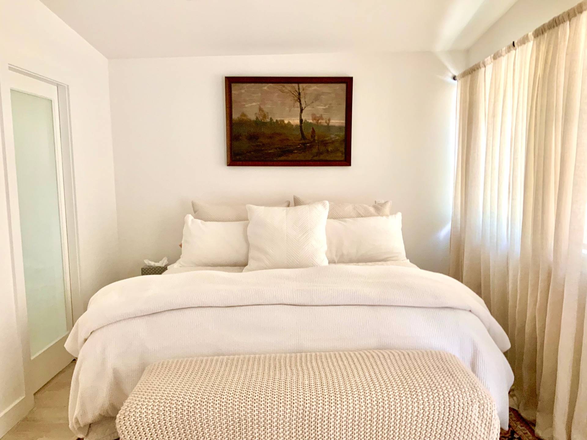 61 Rutland Road East Hampton, NY 11937 - Photo 12 of 19 a large white bed in a small room