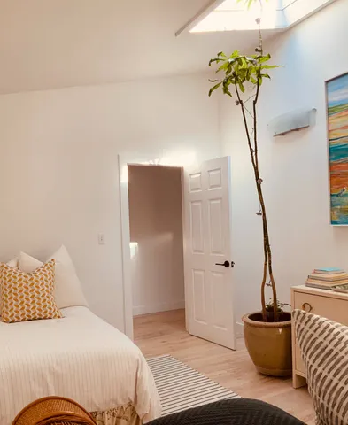 a living room with a dresser and gym equipment