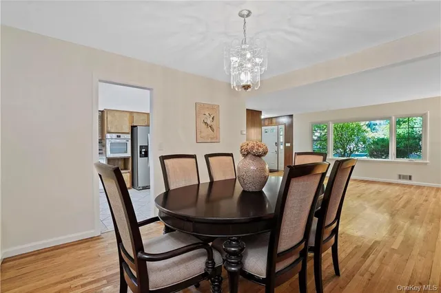 a kitchen with granite countertop stainless steel appliances a refrigerator sink and microwave