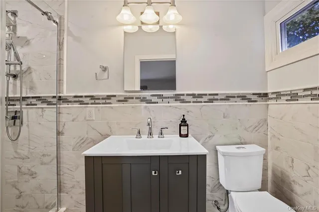 a bathroom with a sink and mirror
