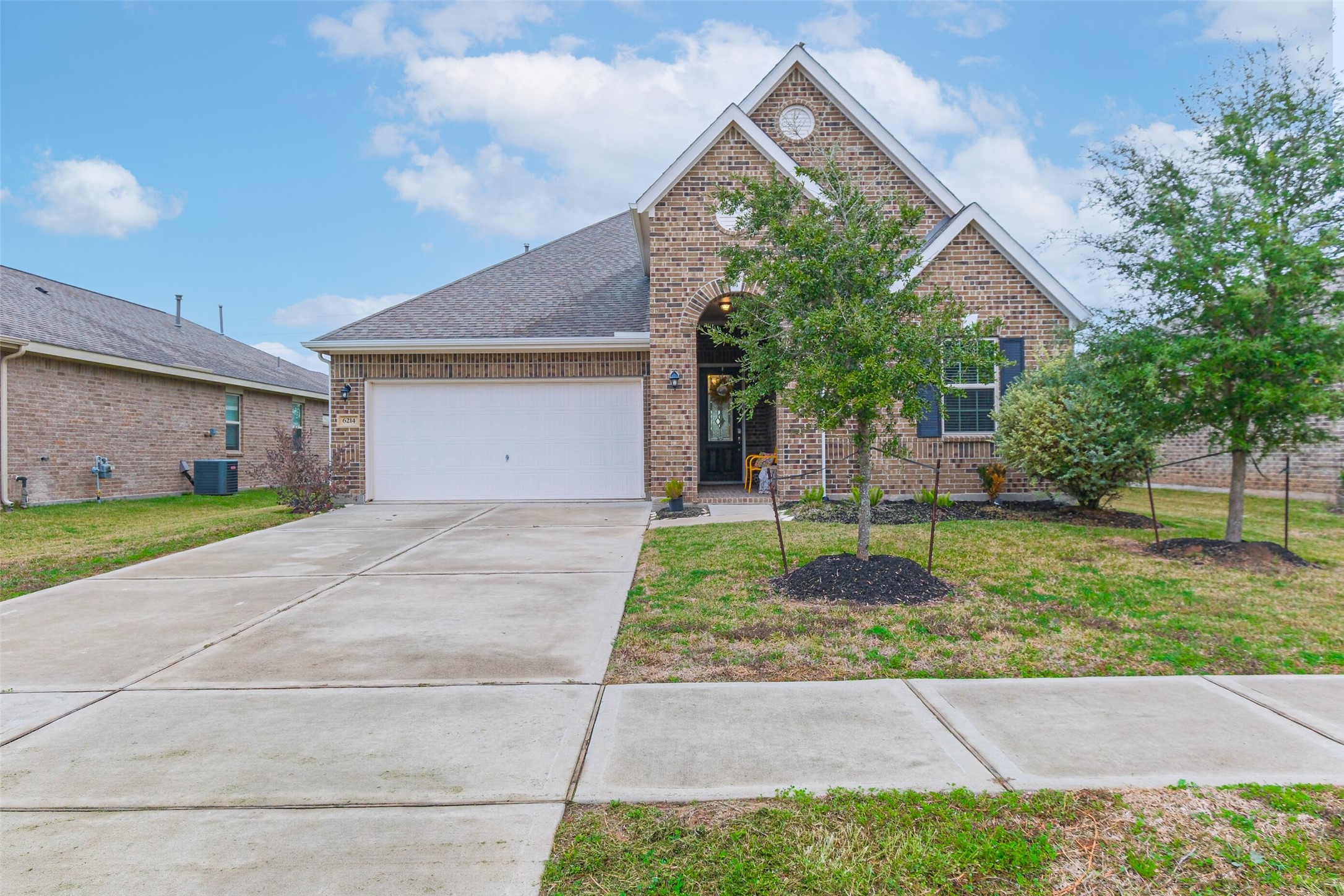 6214 Scott Way Rosenberg, TX 77471 - Photo 1 of 19 a front view of a house with garden