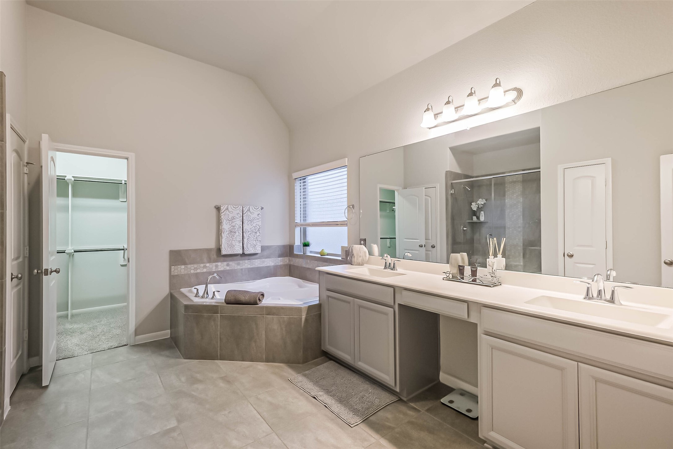 6214 Scott Way Rosenberg, TX 77471 - Photo 13 of 19 a large bathroom with a double vanity sink mirror and bathtub