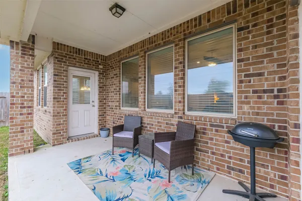 a outdoor living space with furniture and a potted plant