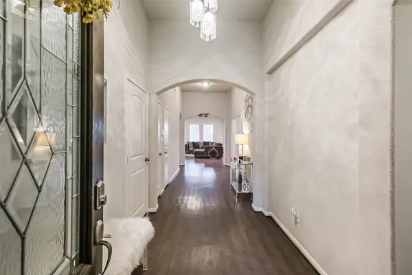 a view of hallway with wooden floor