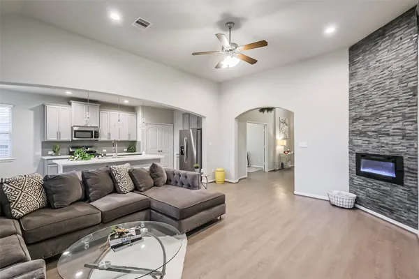 a living room with furniture and a fireplace