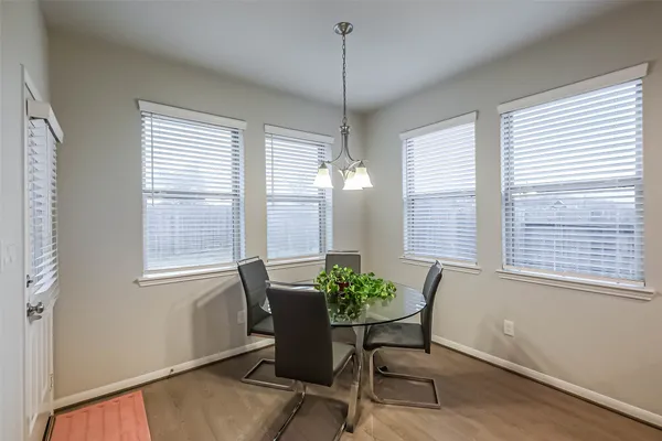 a dining room with furniture and window