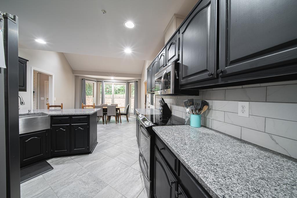 111 Stoneridge Road Cataula, GA 31804 - Photo 13 of 45 a kitchen with sink and refrigerator