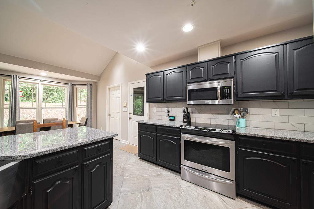 111 Stoneridge Road Cataula, GA 31804 - Photo 16 of 45 a kitchen with stainless steel appliances wooden cabinets and a sink