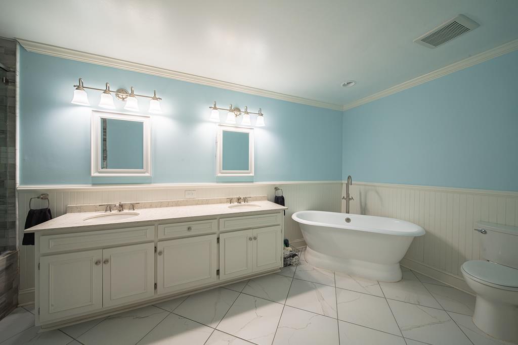 111 Stoneridge Road Cataula, GA 31804 - Photo 20 of 45 a spacious bathroom with a double vanity sink mirror and toilet